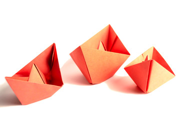 Three red boats isolated on a white background