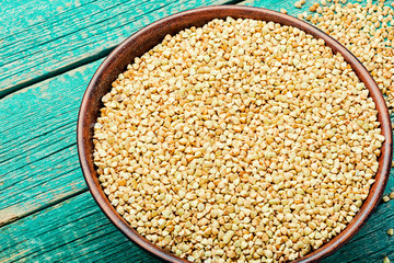 Green buckwheat on wooden table