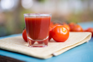 Fresh tomatoes juice in drinking healthy concept.