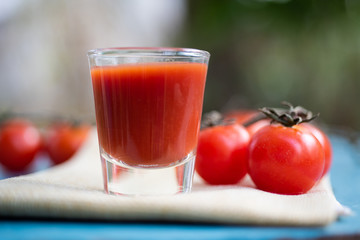 Fresh tomatoes juice in drinking healthy concept.