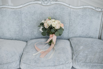 bridal bouquet on the sofa in the room