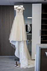 wedding dress hanging on the wall