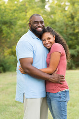 Fototapeta premium Father and his daughter laughing and playing at the park.