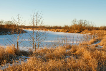 winter road in the field at sunrise