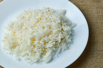 White rice on the plate on isolated background