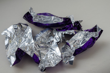 Empty candy wrappers. Tasty sweets wrappers. Holiday for children. Close-up. Selective focus.
