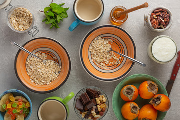 Breakfast of cereal and fruit. Cooking on gray concrete