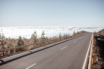 Beautiful straight road above the clouds on Tenerife island, Spain