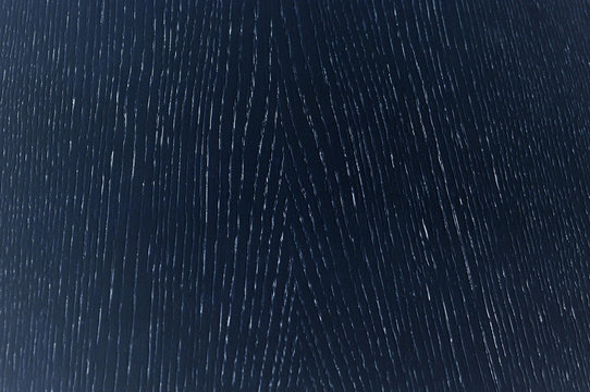 The texture of the wooden coating of furniture. Oak, black color.