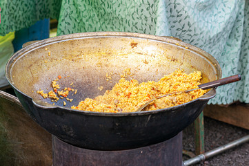 pilaf in a large cast-iron utensil
