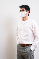 Asian businessman wearing surgical mask to prevent flu disease Coronavirus