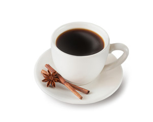 Cup of aromatic black coffee in a white cup isolated on a white background with star anise and cinnamon sticks.
