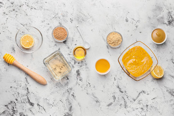 Obraz na płótnie Canvas Tasty honey mustard sauce with ingredients on white background