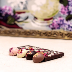 Handmade dark chocolate bar with a variety of dried fruit and nut toppings