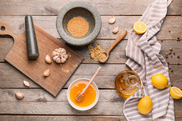 Ingredients for honey mustard sauce on wooden background