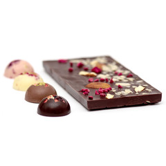 Handmade dark chocolate bar with a variety of dried fruit and nut toppings