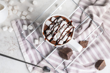 Cup of hot chocolate on white background