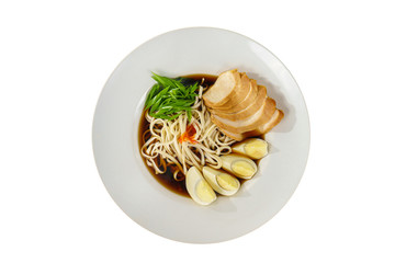 fo bo soup, with vegetables, noodles, greens onions, egg, chicken, spicy red sauce in a white plate isolated white. Serving dishes in a cafe, restaurant, for a menu, view from above
