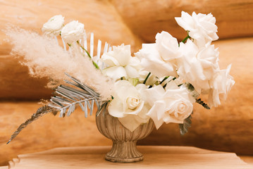 flower arrangement in silver bowl with pink and white roses