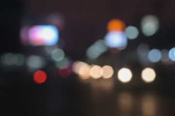 background of bokeh abstract colourful red, gold, blue and black glitter lights. defocused