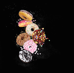 colorful donuts on black background