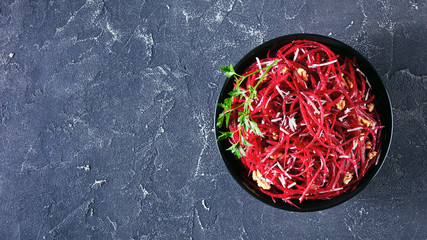 Healthy raw beetroot salad on a bowl, copy space