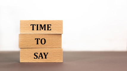 Time to say word written on wood block on white background. Time to say text on wooden table for your desing, concept.