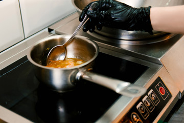 Cooking soup on the stove, lunch menu in a cafe, selective focus