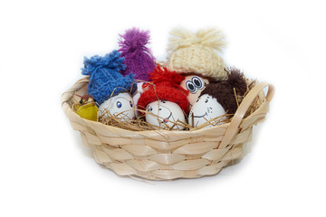Easter eggs dressed in knitted hats.