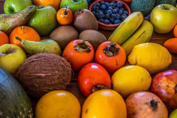 Background with an assortment of healthy freshly picked fresh fruit. Vegan or vegetarian choice.