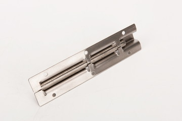The simple silver metal deadbolt against a white background