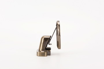 Various metal door stop tools on white background