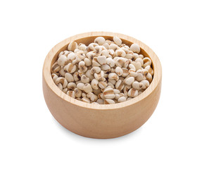 Closeup white Job's tears ( Adlay millet or pearl millet ) in wooden bowl an isolated on white background