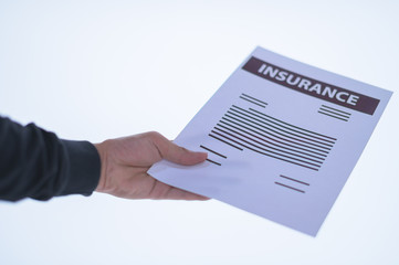 Businessman hand holding a document. Scenes white background.