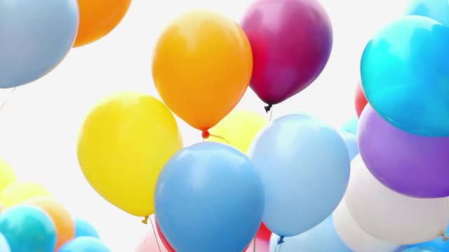 Many colorful balloons flying in the air. Celebration and birthday concept.