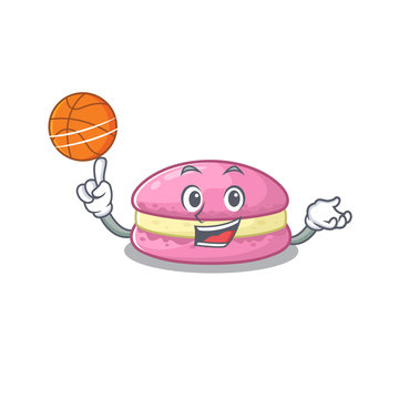 A mascot picture of strawberry macarons cartoon character playing basketball