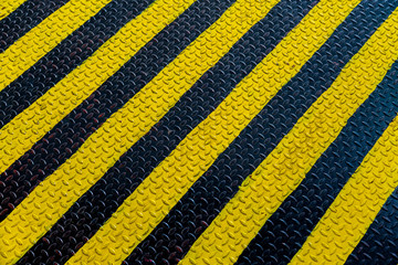 Steel sheet with yellow and black strip