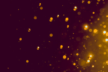 Abstract gold blur glitter bokeh on black