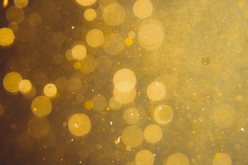 Dark Abstract Gold bokeh sparkle on black