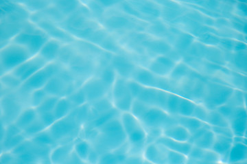 Fototapeta na wymiar Blue water ripple reflection in the swimming pool