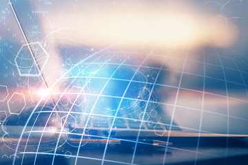 Multi exposure of table with computer and world map hologram. International data network concept.