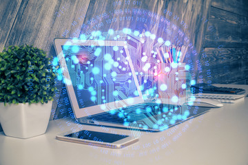 Multi exposure of work table with computer and brain hologram. Brainstorm concept.