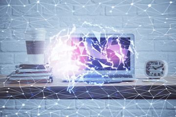 Double exposure of table with computer and brain hologram. Data innovation concept.