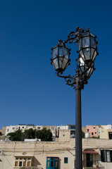 Stylish wroght iron street lamp with blue sky