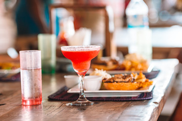 Close up of delicious fresh burger with tasty cocktail