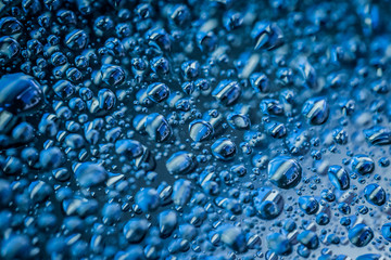 Water droplets on blue