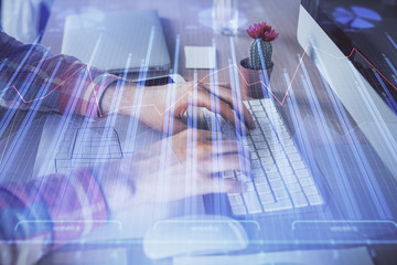 Double exposure of stock market chart with man working on computer on background. Concept of financial analysis.