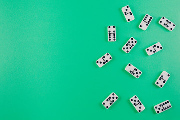 top view of domino tiles on green background