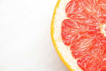 grapefruit halves on a white table without a background