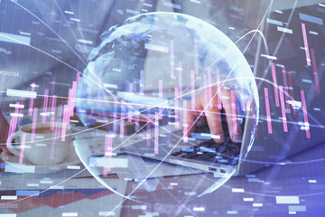 Forex graph with businessman working on computer in office on background. Concept of hardworking. Multi exposure.